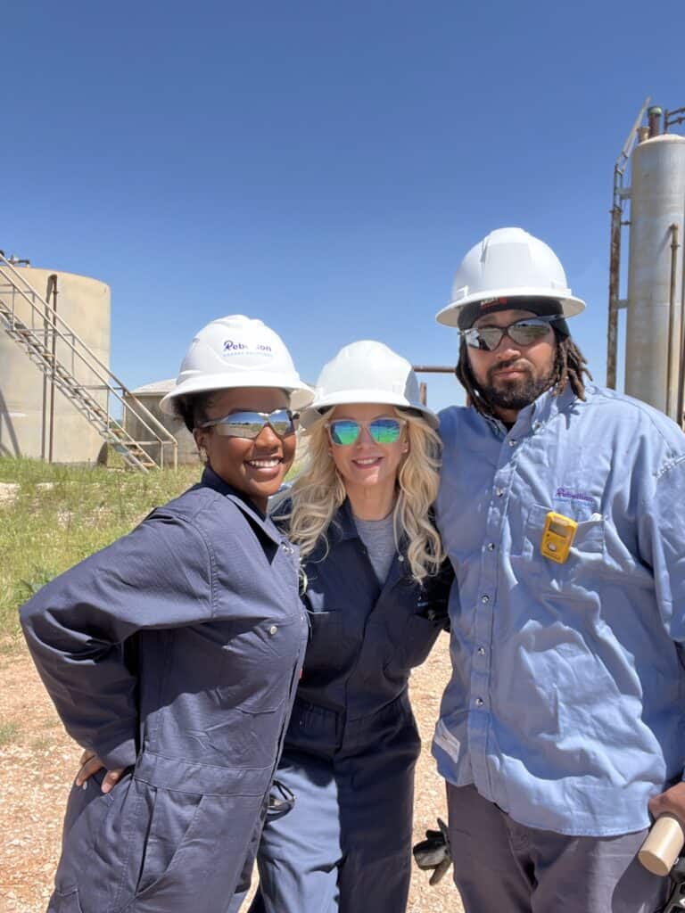 a group of people wearing hard hats and sunglasses